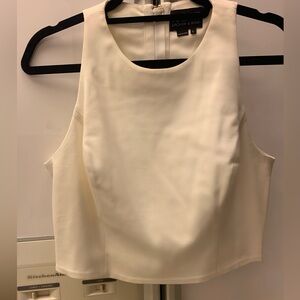 Very stylish off white cropped top with 4 cutouts in the back.